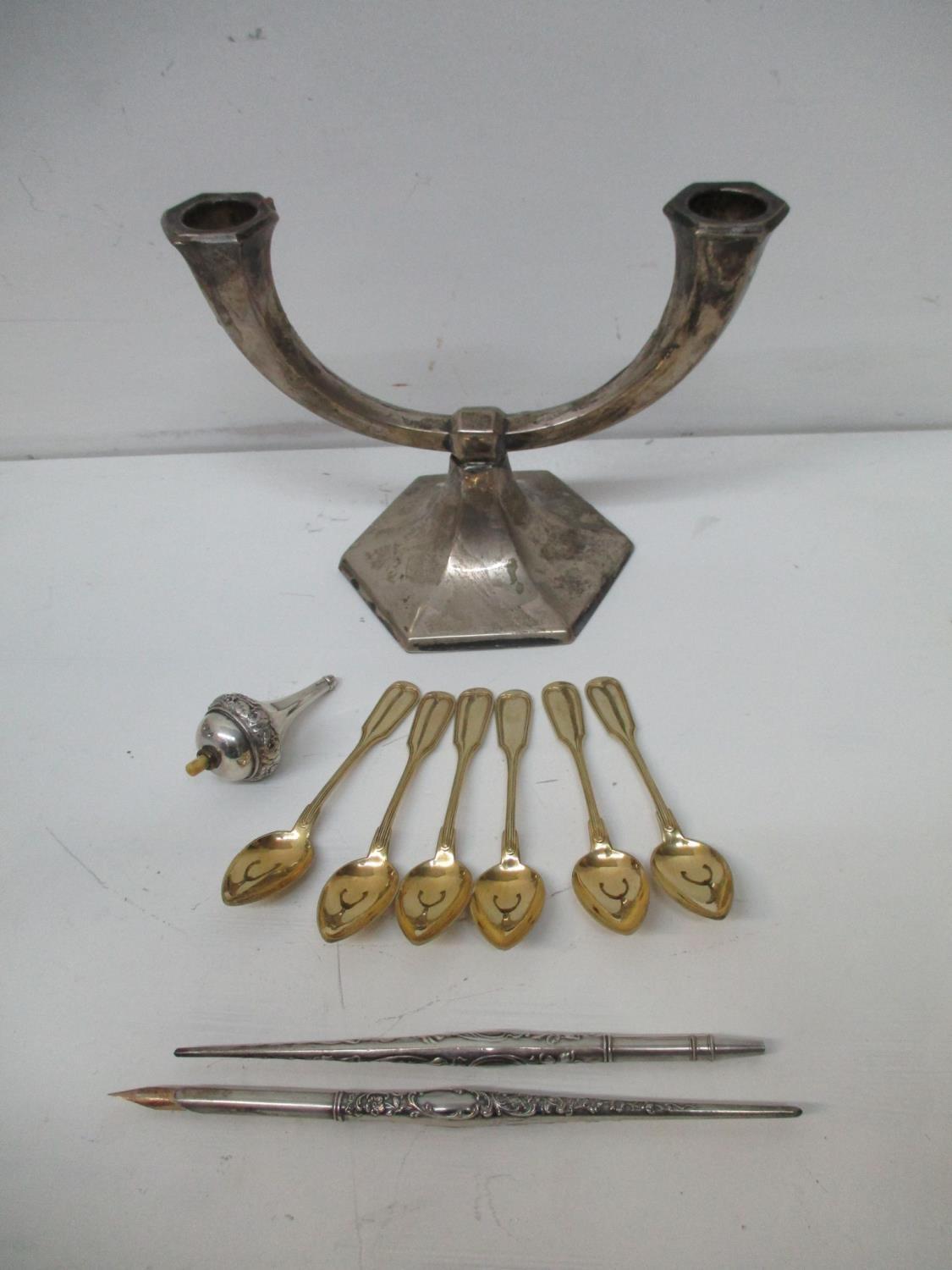 Mixed white metal items to include six gilt coffee spoons, an electric bell push with an ivory