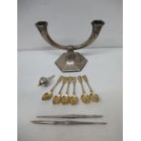 Mixed white metal items to include six gilt coffee spoons, an electric bell push with an ivory