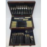 A George V canteen of silver and stainless steel cutlery, Sheffield 1926, by Cooper Brothers & Sons,