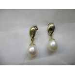 A pair of 9ct gold earrings each with a pearl pendant, 2.6g