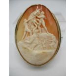 A 9ct yellow gold framed Victorian cameo brooch with oval shell cameo depicting a Grecian scene with