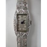 An Omega white gold and diamond ladies wristwatch with rectangular dial with Arabic numerals,