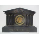 A late 19th century French Samuel Marti black marble cased mantle clock. The architectural case