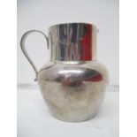 An early 20th century silver cream jug by S & Co London 1913, with a cylindrical neck and baluster
