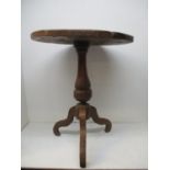 A mid 20th century Old English style ash pedestal table with a one piece top, a knopped column and a