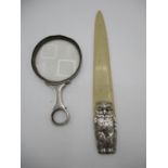 A silver and bone paper knife hallmarks indistinct, the repousse handle in the form of a standing