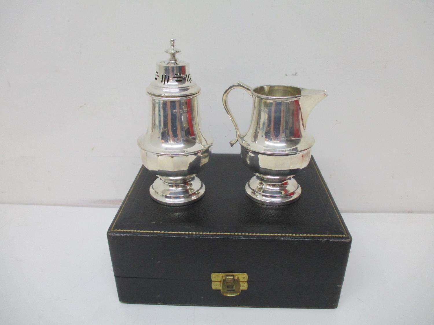 A 1930s silver sugar caster and a matching cream jug by William Neale, Birmingham 1931 with