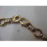 An Italian gold coloured metal necklace with circular and ring links, stamped 14k, b.65, 17" long,