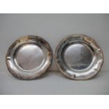 Two early 19th century French white metal salvers, inscribed to the underside Dupanchel a Paris,