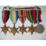 A group of five World War II medals comprising of a British War, a Pacific Star, an African Star, an