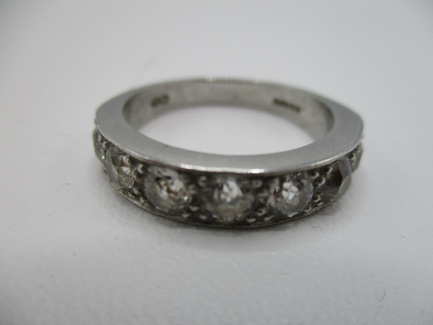 A platinum and diamond half eternity ring set with seven brilliant cut diamonds, approx 1.3 carat