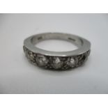 A platinum and diamond half eternity ring set with seven brilliant cut diamonds, approx 1.3 carat