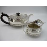 A late Victorian silver teapot, London 1894 stamp for Munday, Great Portland Street, of circular