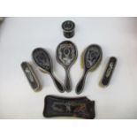 An Edwardian silver and tortoiseshell pique work, seven piece dressing table set, makers marks