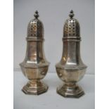 A pair of mid 18th century Dutch silver sugar castors, Amsterdam 1746, by Gerrit Boverhof, having