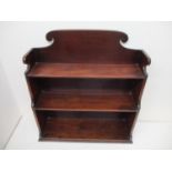 A George III mahogany three tier waterfall shelf with a shaped gallery, 26" h x 24 1/2"w x 8"d