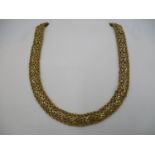 A 14ct (585) Italian yellow gold neck chain with rope border and mesh S link central decoration, 17"