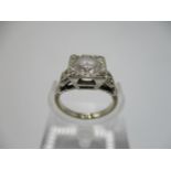 An 18ct white gold, diamond solitaire ring, approximately 1 1/4 carat, in a square setting,