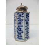 An 18th century Chinese tea caddy of rectangular form with canted corners decorated with flowers and
