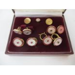A 1980s nine piece, 9ct gold and enamelled gentleman's shirt stud set with matching cufflinks,
