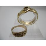 An 18ct gold buckle ring size R, 2.85g and a 9ct gold ring with embossed lettering size I, 1.70g