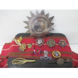 A Victorian silver breast badge and sash along with military and other badges to include British