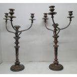 A pair of large Victorian candelabra with a central sconce and three scrolled branches, on