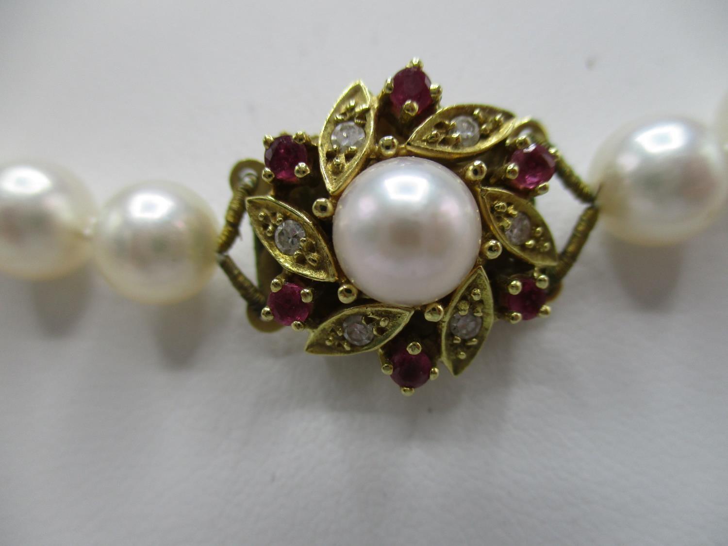 A cultured pearl necklace with an 18ct gold pearl/diamond and ruby set clasp, 24 1/2" long, - Image 3 of 6