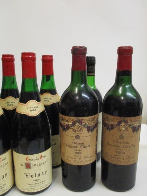 A quantity of seven mixed reds to include Chateau Pontet Canet Pauillac 1962 and Valnay 1969