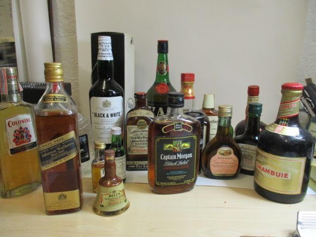 A collection of twenty mixed bottles of spirits to include miniatures, Jamaican rum, whiskeys and