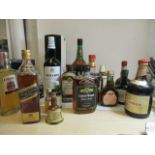 A collection of twenty mixed bottles of spirits to include miniatures, Jamaican rum, whiskeys and