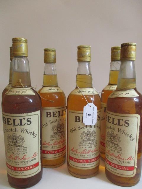 Six 26 2/3 fl oz bottles of Bells Old Scotch Whisky