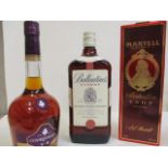 Three bottles to include Martell Cognac 0.50l Ballantiens blended Scotch Whisky 1l and Courvoisier
