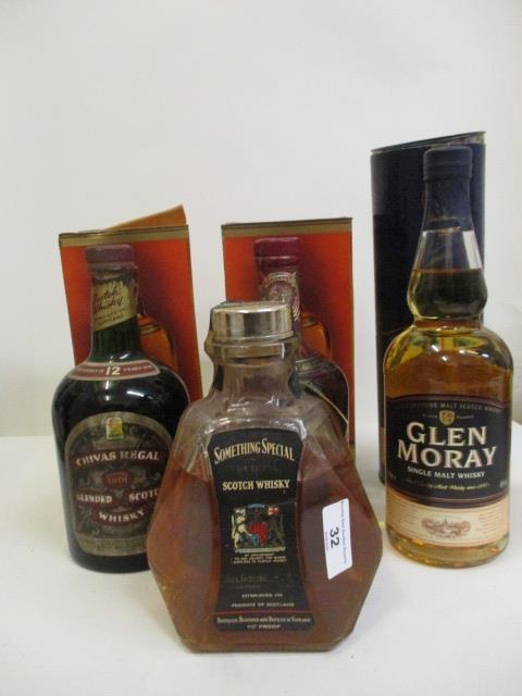 Four bottles of Scotch Whisky to include Chivas Regal, Glen Moray and Something Special