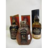 Four bottles of Scotch Whisky to include Chivas Regal, Glen Moray and Something Special