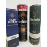 Two bottles of Glenfiddich and one bottle of Glen Moray Speyside malt whisky