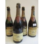 Three bottles of Krug & Co 1937 Extra Sec Champagne and one bottle of Krug & Co 1928 A/F showing