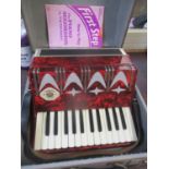 A cased Firotti accordion