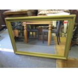 A contemporary wall mirror with bevelled glass 27" x 38 1/4"