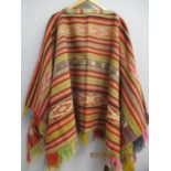 A multi coloured, handwoven Peruvian wool poncho, 29" long A/F