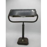 An early to mid 20th century Bankers desk lamp with green painted adjustable metal shade, circa 1930