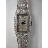 An Omega white gold and diamond ladies wristwatch with rectangular dial with Arabic numerals,