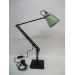 A Herbert Terry black anglepoise table lamp with green coloured shade and stepped base, circa