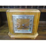 A mid 20th century walnut 8 day mantle clock, striking on nine rods