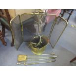 A selection of brass fireside items to include a coal bucket, screen and other items