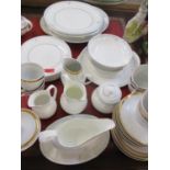 A Royal Doulton Carnation part dinner service having a white background with a carnation sprig to