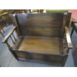 An early 20th century oak monks bench, 35 1/4" H x 40 1/2" W