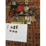 A collection of miscellaneous items to include an AA car badge, Royal Engineer & other cap badges,