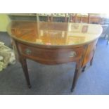 An early 20th century George III style mahogany D shaped sideboard with twin doors