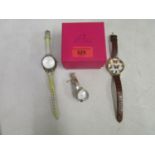 A group of ladies wristwatches to include a Pia watch with silver bracelet, boxed, a Fossil watch